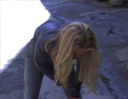 File:Powers Claire fixes her leg.jpg