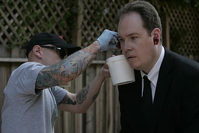 File:Drew applies blood to Agent Howard.jpg