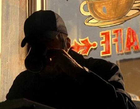 File:Sylar sips his coffee and enjoys it.jpg