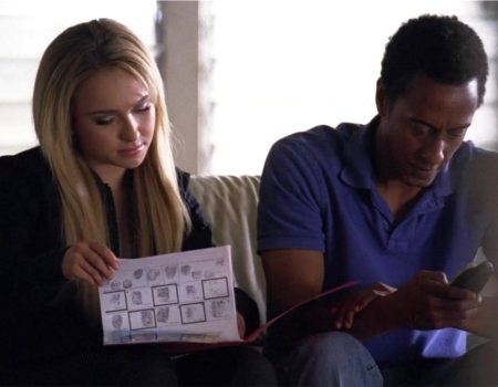 File:Claire shows Canfield his file.jpg