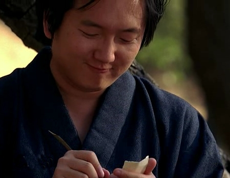File:Hiro writes a scroll.jpg