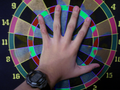 Rowan manipulates the color of his dartboard.