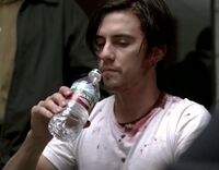 Peter drinking water (that's Matt behind him, face out of camera). Matt attempted to use his power on him, with negative results. This site should have better images of it.