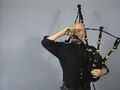 ..play bagpipes while drinking a pint...